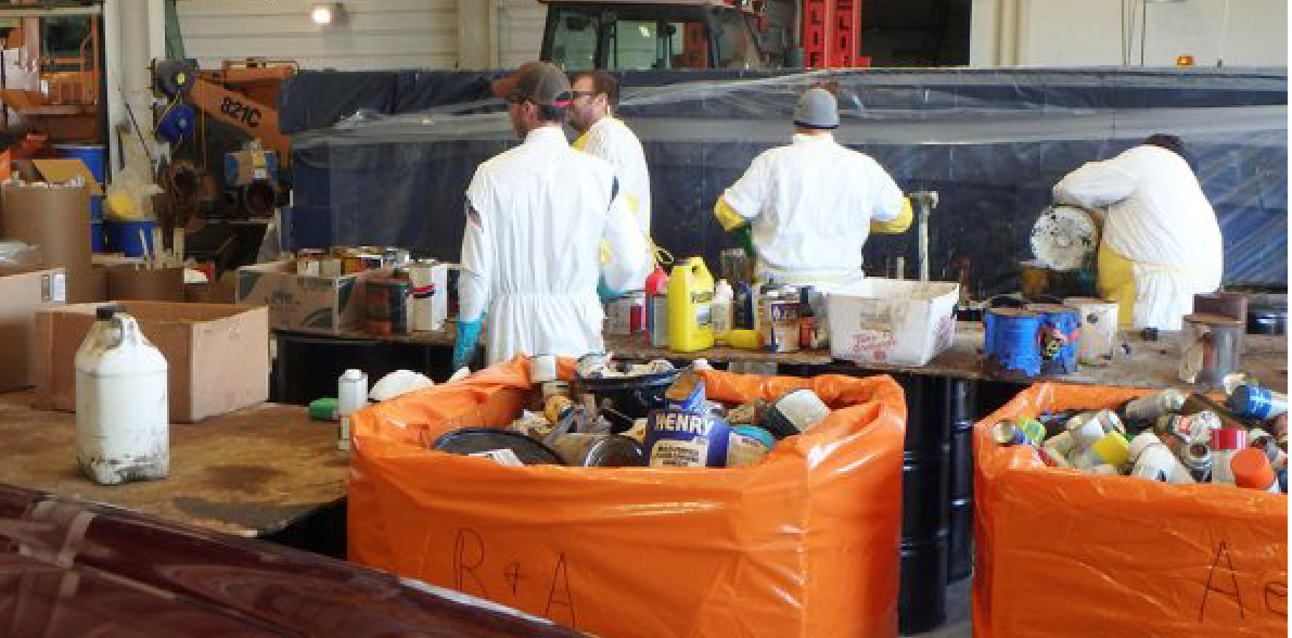 WastePack PRO XL being used for household hazardous waste removal, hazmat box with orange liners